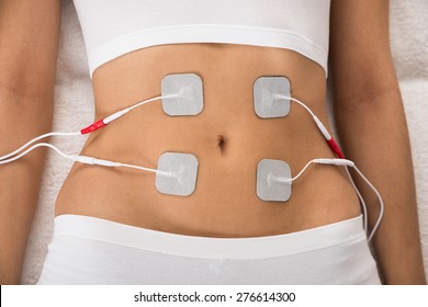 High Angle View Of A Woman With Electrodes On Her Stomach