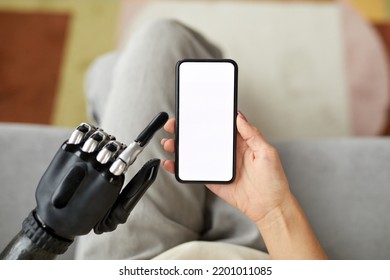 High Angle View Of Young Cyborg Girl Using Mobile Phone For Online Communication