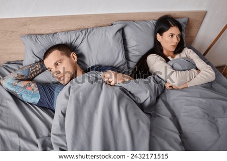 Similar – Image, Stock Photo Diverse couple lying on blue background