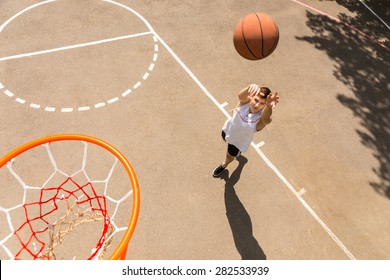 High Angle View of Young Man Playing Basketball, View from Above Hoop of Man Shooting Basketball - Powered by Shutterstock