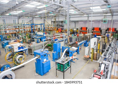 A High Angle Wide Shot Of A Factory Manufacturing Aluminum Light Fittings.