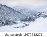 High angle and winter view of heavy snow on rocks and trees at Ssangcheon Stream of Seoraksan Mountain near Sokcho-si, South Korea
