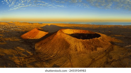 High aspect aerial panoramic view of Volcan Calderon Hondo volcano and crater at sunrise near Lajares Corralejo in Fuerteventura Canary Islands Spain - Powered by Shutterstock