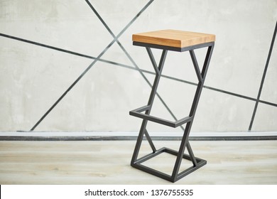 High Bar Stool Made Of Wood And Metal.