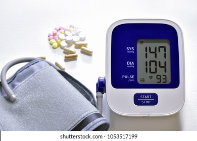 High Blood Pressure Monitor Can Be Treated With Medication Concept.