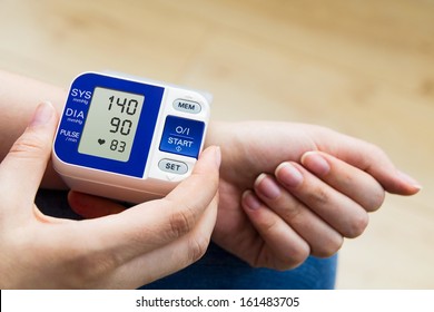 High Blood Pressure. Woman Measures The Pressure