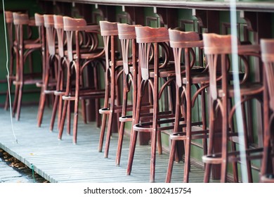 High brown bar stools are empty