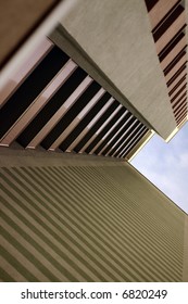 high building full of stripes in urban area