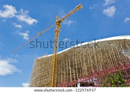 High Building Under Construction with Crane.