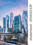 High buildings of Moscow-City at Moskva River at summer sunset, Russia. Moscow-City is business district in Moscow. Panorama of modern office buildings at summer sumset, Moscow downtown in summer.