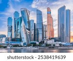 High buildings of Moscow-City at Moskva River at summer sunset, Russia. Moscow-City is business district in Moscow. Panorama of modern office buildings at summer sumset, Moscow downtown in summer.