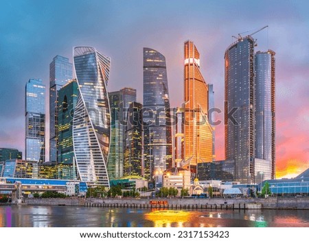 High buildings of Moscow-City at Moskva River at summer sunset, Russia. Moscow-City is business district in Moscow. Panorama of modern office buildings at summer sumset, Moscow downtown in summer.