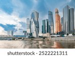 High buildings of Moscow-City, view from cruise ship and Moskva River at summer day, Russia.. Moscow-City is business district in Moscow. Moscow downtown in summer.