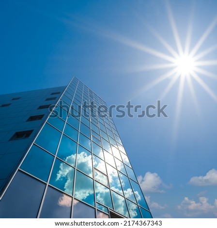 high business centre building in light of sparkle sun