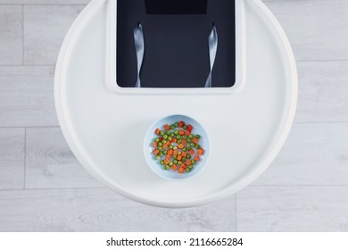 High Chair With Healthy Baby Food Served On White Tray Indoors, Top View