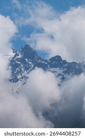 High cliffs at dawn in clouds and snow