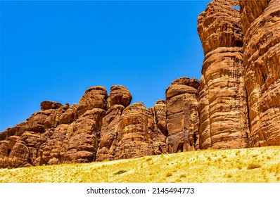 High cliffs of red sand rocks. Sandstone rocks in canyon desert. High sandstones in canyon desert. Canyon desert sandstones