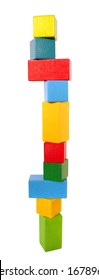 A High Colorful Block Tower Of Wooden Building Blocks. Fragile Balance. Isolated On A White Background. Front View.