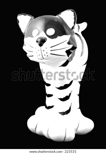 black and white ceramic cat figurine