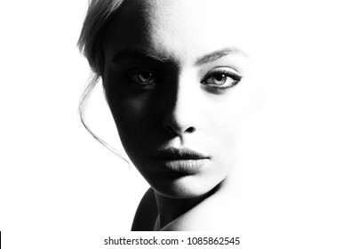 High contrast black and white portrait of a beautiful girl.