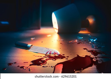 High Contrast Image Of Bloody Crime Scene With A Knife On The Floor