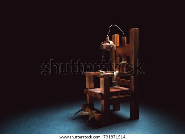 High contrast image of an electric chair on a\
dark background
