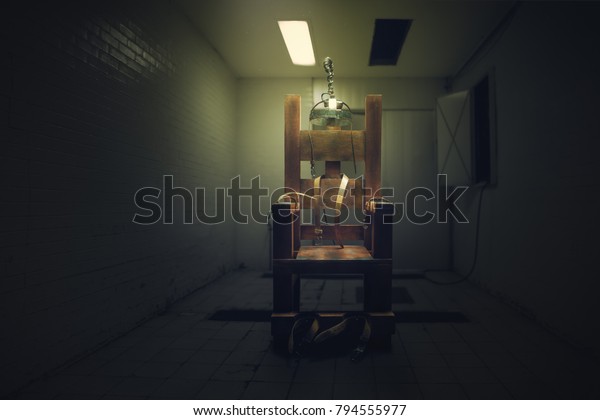 High\
contrast image of an electric chair on a dark\
room