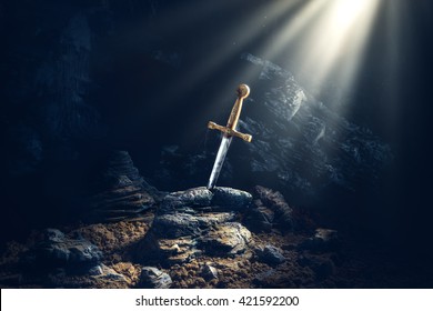 High contrast image of Excalibur, sword in the stone with light rays and dust specs in a dark cave
