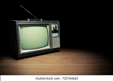 High Contrast Image Of An Old Vintage TV On White Wood.