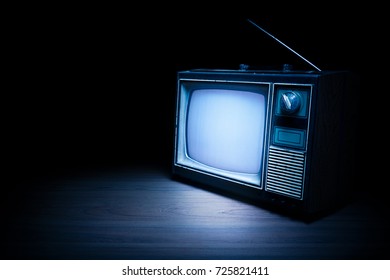 High Contrast Image Of An Old Vintage TV With White Noise On White Wood.