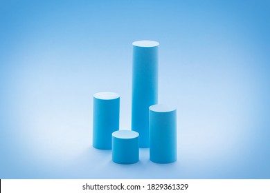 High cylindrical podiums on pastel blue background. Empty showcase design mockup for promotion sale, presentation of cosmetic products, seasonal and holiday discounts. 3D chart or graph - Powered by Shutterstock - Get 15% off with code: PIKWIZARD15