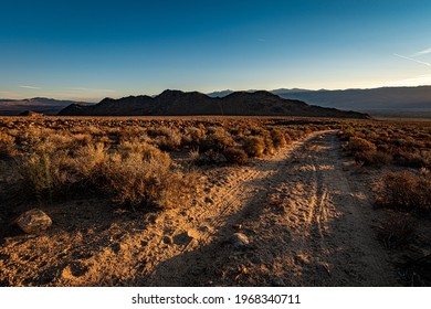 High Desert Dirt Road To Hills And Mountains In Eastern Sierras Of California