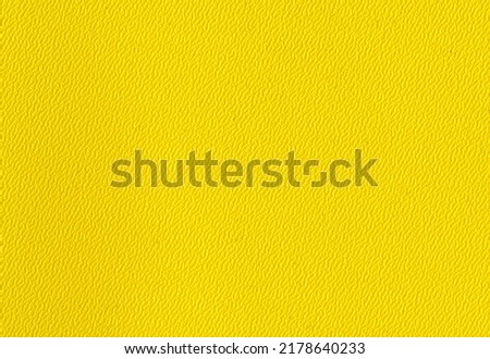 High detail large image close up bright yellow plastic binder back cover paper texture background scan fine grain mesh with small dots pattern for mockup or high res wallpaper with copyspace for text