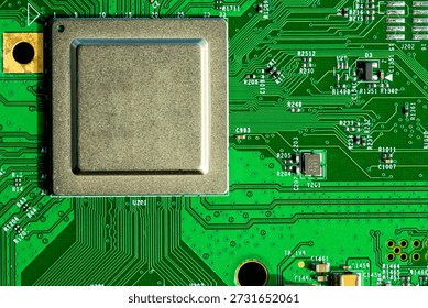 High detail macro image of microprocessor installed on green circuit board