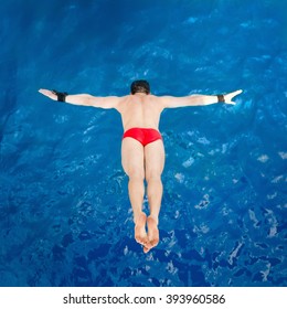 High Diver, Flying Towards Water From Diving Platform, Shot From Above