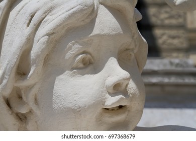 High Dynamic Range detail of a child’s face statue.