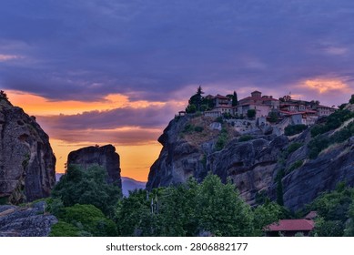 High dynamic range HDR landscape view of Meteora in central Greece, showcasing dramatic sandstone rock pillars rising above the Thessalian plain. The scene captures the unique geological formations topped with historic Orthodox monasteries, blending natural rock architecture with centuries-old spiritual heritage. Enhanced HDR detail reveals rich textures in the cliffs, valleys, and surrounding vegetation under dynamic lighting conditions. Meteora is a UNESCO World Heritage Site and one of Greece’s most iconic landscapes, known for its striking vertical rock formations and monastic settlements. The image emphasizes depth, contrast, and atmosphere, making it ideal for themes of travel, tourism, nature, geology, culture, and landscape photography