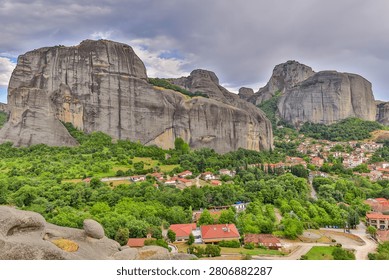 High dynamic range HDR landscape view of Meteora in central Greece, showcasing dramatic sandstone rock pillars rising above the Thessalian plain. The scene captures the unique geological formations topped with historic Orthodox monasteries, blending natural rock architecture with centuries-old spiritual heritage. Enhanced HDR detail reveals rich textures in the cliffs, valleys, and surrounding vegetation under dynamic lighting conditions. Meteora is a UNESCO World Heritage Site and one of Greece’s most iconic landscapes, known for its striking vertical rock formations and monastic settlements. The image emphasizes depth, contrast, and atmosphere, making it ideal for themes of travel, tourism, nature, geology, culture, and landscape photography