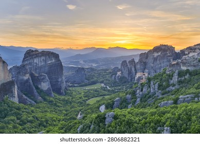 High dynamic range HDR landscape view of Meteora in central Greece, showcasing dramatic sandstone rock pillars rising above the Thessalian plain. The scene captures the unique geological formations topped with historic Orthodox monasteries, blending natural rock architecture with centuries-old spiritual heritage. Enhanced HDR detail reveals rich textures in the cliffs, valleys, and surrounding vegetation under dynamic lighting conditions. Meteora is a UNESCO World Heritage Site and one of Greece’s most iconic landscapes, known for its striking vertical rock formations and monastic settlements. The image emphasizes depth, contrast, and atmosphere, making it ideal for themes of travel, tourism, nature, geology, culture, and landscape photography