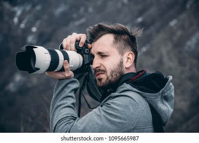 High end camera user.  Camera operator. Photographing the photographer. - Powered by Shutterstock