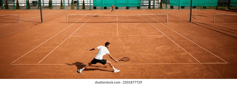 High energy tennis match between two competitive and focused men, tennis players on outdoor clay court. pushing own sportive limits. Concept of sport, competition, active and healthy lifestyle - Powered by Shutterstock