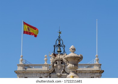 High Facade Of The Royal Palace Of Madrid Waving The Spanish Flag In The Wind. June 15, 2019. Madrid. Spain. Travel Tourism Holidays