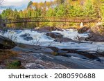 High Falls in Greater Sudbury Ontario Canada in autumn, Onaping River, sunny blue sky, vibrant colors, scenic