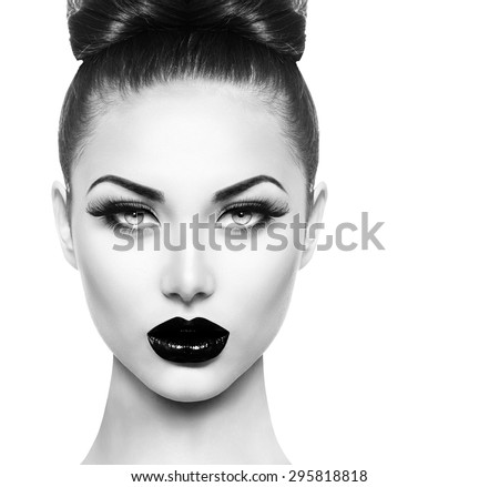Similar – Image, Stock Photo Portrait of a gothic rocker-looking woman, looking directly at the camera, wearing a leather jacket, on plain gray background