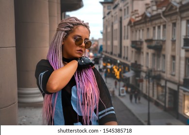 High Fashion Gangsta Girl Model With Trendy Make-up At Day Lights On Balcony. Woman With African Braids