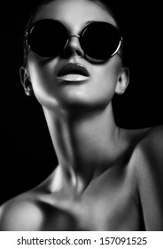 High Fashion Look.glamor Closeup Portrait Of Beautiful Sexy Stylish Mode In Sun Glasses  With Perfect Clean Skin In Studio