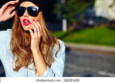 High Fashion Look.glamor Lifestyle Blond Woman Girl  Model In Casual Jeans Shorts Cloth  Outdoors In The Street In Black Cap  In Glasses