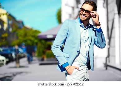 High Fashion Look.Young Stylish Confident Happy Handsome Businessman Model  In Suit Cloth Lifestyle In The Street In Sunglasses