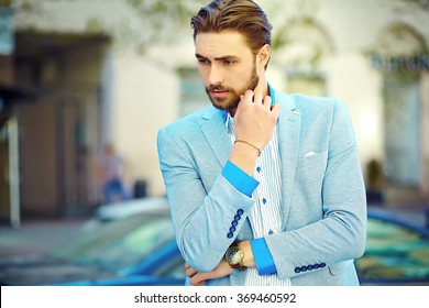 High Fashion Look.Young Stylish Confident Thinking Handsome Businessman Model Man In Blue Suit Cloth Lifestyle In The Street