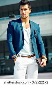 High Fashion Look.Young Stylish Confident Happy Handsome  Businessman Model Man In Blue Suit Cloth Lifestyle In The Street 